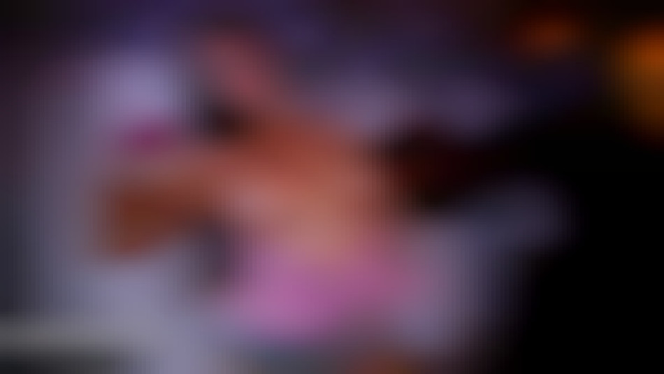 fit girl flexing her bicep in gym