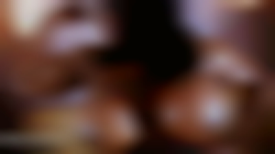 Yvette Bova flexing her biceps topless