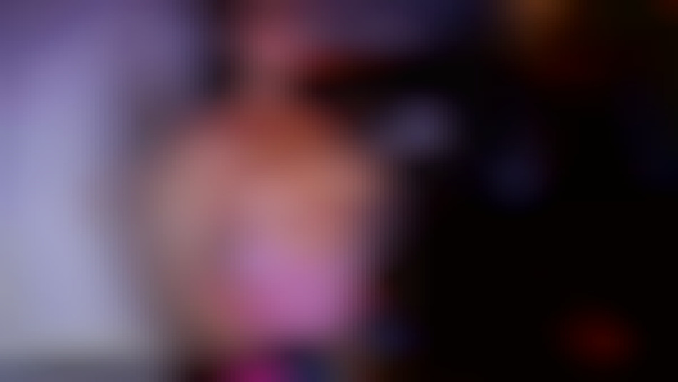 fitness model topless flexing