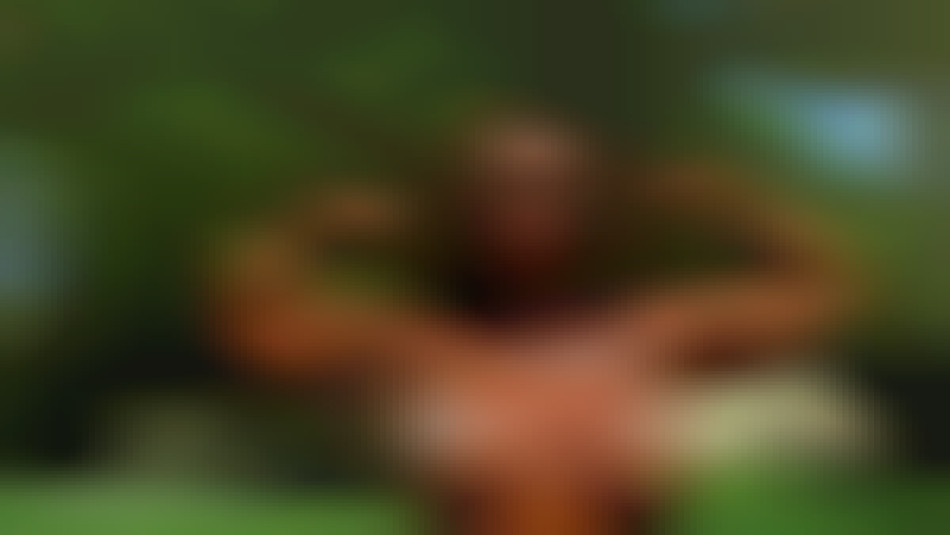 female bodybuilder flexing biceps and big tits