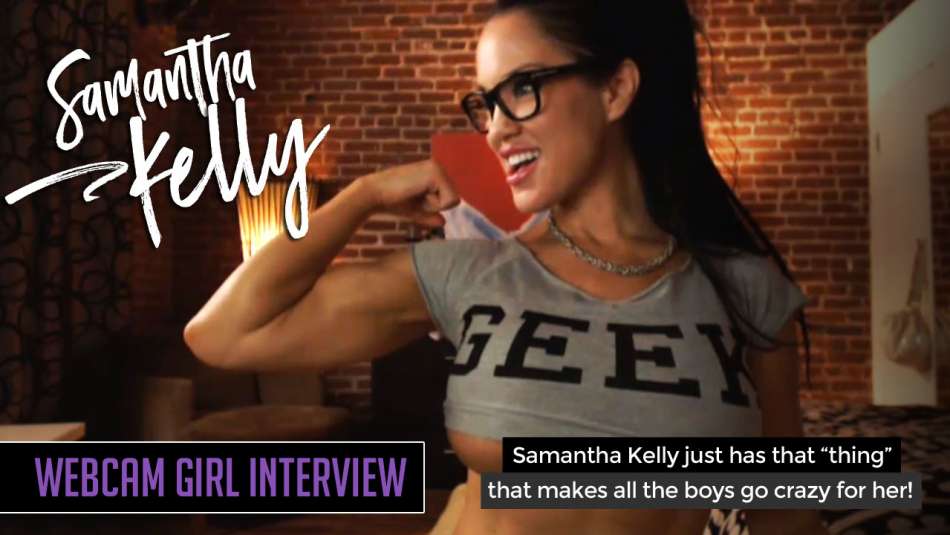 Samantha Kelly flexing her bicep on her webcam